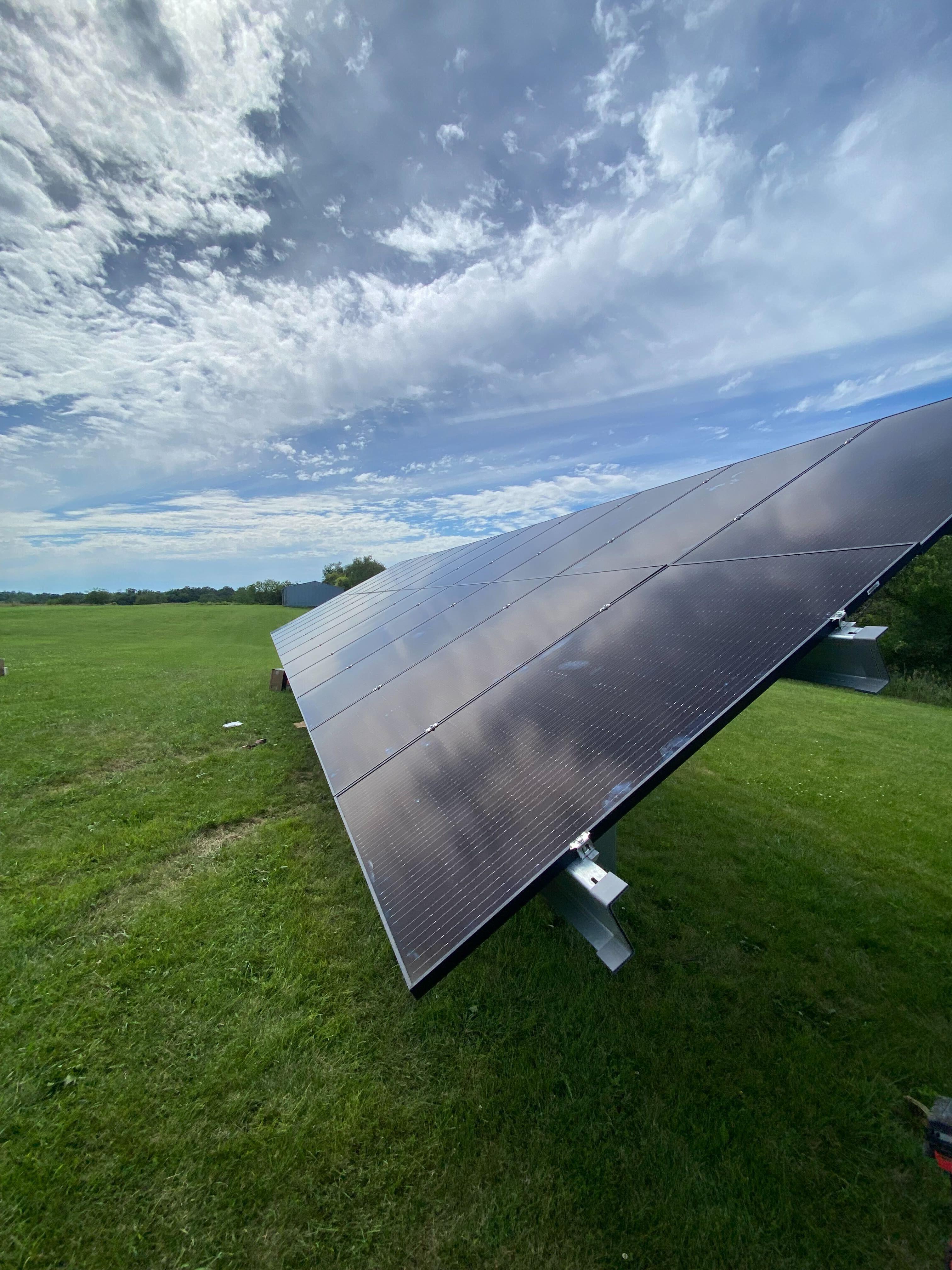 Ground mount solar panel installation on Iowa farm